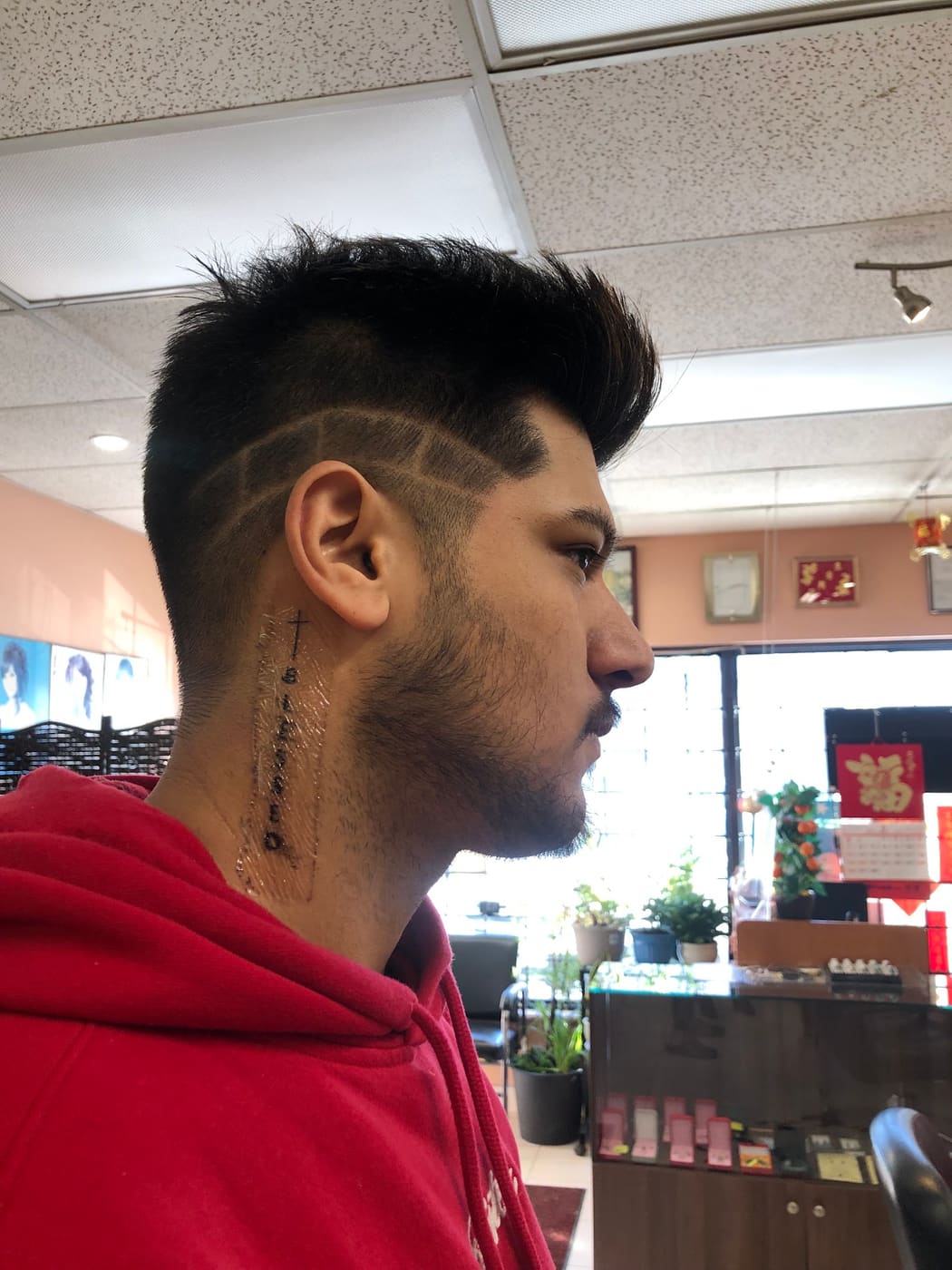 Shaved hair design with fade, side profile